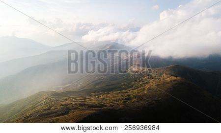 View Of The Mountains Range In Clouds From A Bird's Eye View