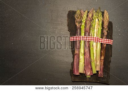 Purple Green White Asparagus Flat Lay On Black Stone Background. Vegetarian Dieting Organic Healthy