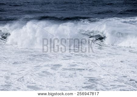 Stormy Clouds And Crashing Ocean Waves During Storm In The Atlantic Ocean