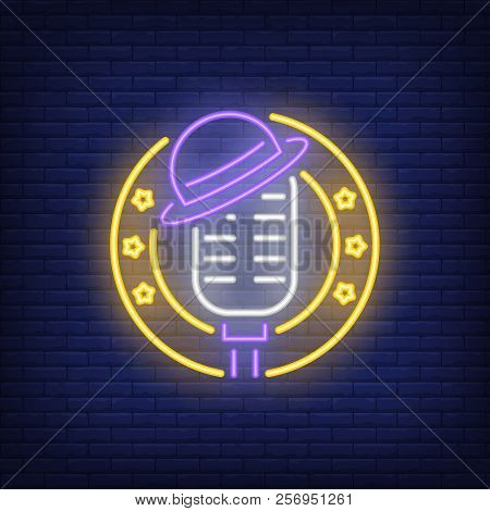 Stage Neon Icon. Mic With Hat In Circle Frame With Stars On Brick Wall Background. Show Concept. Vec