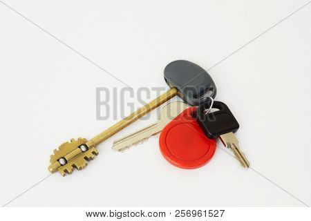 Set of keys on ring on white background.