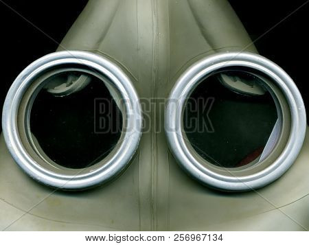 Old Soviet Green Gas Mask. The Eye Of An Old Gas Mask. Postapocalypse.