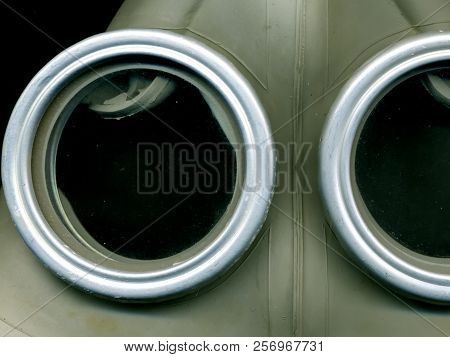 Old Soviet Green Gas Mask. The Eye Of An Old Gas Mask. Postapocalypse.