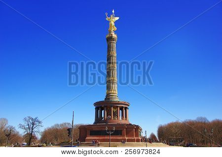 The Victory Column (siegessauele) In Berlin With The Golden Statue Of Ancient Greco-roman Goddess Ni