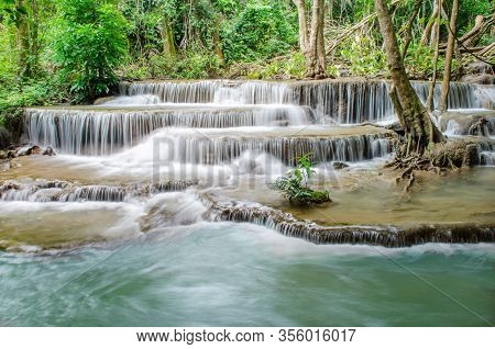 Travel To The Beautiful Waterfall In Tropical Rain Forest, Soft Water Of The Stream In The Natural P
