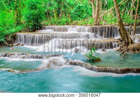 Travel To The Beautiful Waterfall In Tropical Rain Forest, Soft Water Of The Stream In The Natural P
