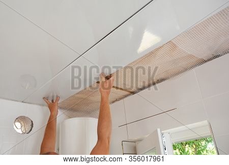 Pvc Ceiling Panels, Cladding Installation. Builder Installing, Renovate, Repair White Pvc Ceiling Bo