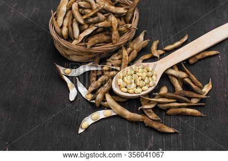 Organic Food. Soy Diet. Soybean Seeds On The Kitchen Table