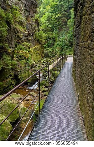 Metal Footbridge In The Gorge Of Kamienczyk River In Polish Giant Mountains