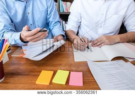 Teaching Helping And Study Course, Team Of Young Teacher Or Tutor Helps Students To Learning In Clas