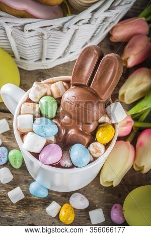 Easter Hot Chocolate With Chocolate Bunny Rabbits. Easter Eggs And Marshmallow, Wooden Background Wi