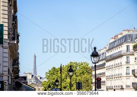Paris/france - September 3, 2019 : Haussmann Building And Eiffel Tower View From A Parisian Boulevar