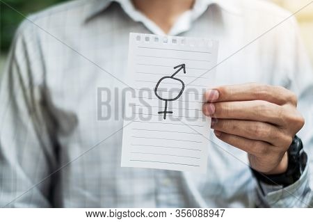 Young Gay Man Hand Showing Paper Note With Gender Of Lgbtq Symbol For Lesbian, Gay, Bisexual, Transg