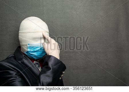Incognito Man In A Medical Mask Is Dressed In A Business Suit