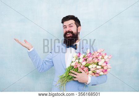 Flower Bouquet For Womens Day. Bearded Man With Tulips. Flowers Shop. Ideas To Celebrate Without Bre