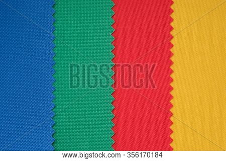 Samples Of Fabrics In Different Colors. Blue, Green, Red Piece Of Fabric With Texture. Lightweight F