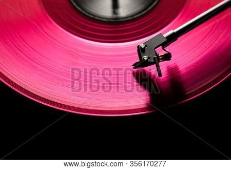 Pink Vinyl Disc. Close-up. Techno Music. Black Background,