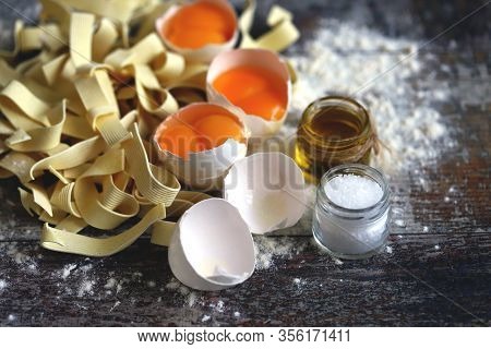 The Concept Of Cooking Egg Noodles. Raw Noodles, Eggs, Flour. Egg Noodles.