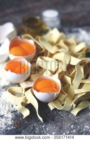 The Concept Of Cooking Egg Noodles. Raw Noodles, Eggs, Flour. Egg Noodles.