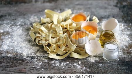 The Concept Of Cooking Egg Noodles. Raw Noodles, Eggs, Flour. Egg Noodles.