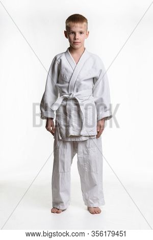 Portrait Of A Boy Athlete Dressed In White Keykogi