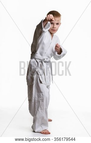 Karate Boy Hits With His Right Hand, White Background