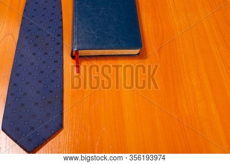 Objects Of Use Of The Office Worker. The Daily Log Of The Businessman On A Table. Workplace Of The M