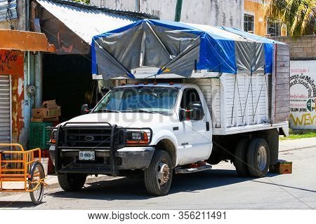 Tulum, Mexico - May 17, 2017: White Agricultural Truck Ford F-450 Super Duty In The City Street.