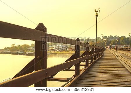 Mon Bridge Or Uttamanusorn Bridge In Sangkhla Buri, Kanchanaburi, Thailand. The Second Longest Wood 
