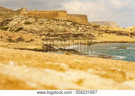 Castle San Ramon Above Beach Of El Playazo, Cabo De Gata Nijar, Province Almer