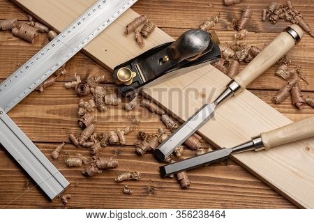 Chisel And Small Block Plane With Wood Shavings
