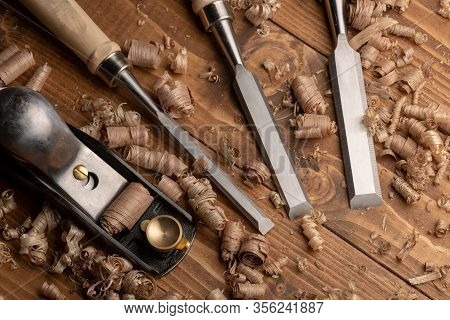 Chisel And Small Block Plane With Wood Shavings