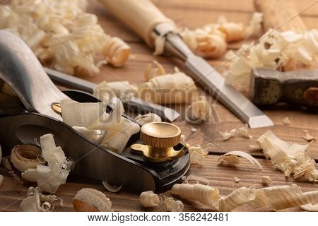 Chisel And Small Block Plane With Wood Shavings