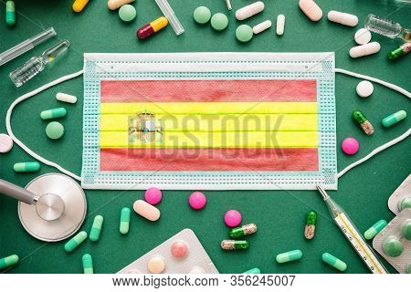 Coronavirus In Spain, Covid-19 Disease Prevention Flatlay With Protective Medical Spain Flag Mask An