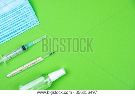 Top View Of Disposable Medical Protective Face Mask, Syringe And Mercury Thermometer, Antibacterial 