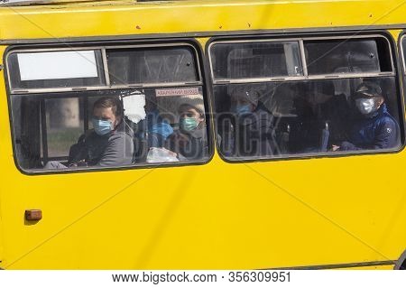 Kiev, Ukraine - March 18, 2020: Passengers In A Protective Mask In Transparte During The Quarantine 