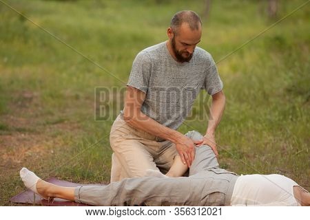 Yumeiho Massage Therapy. Masseur Young Man Doing Oriental Japanese Massage Yumeiho Girl. Concept Of 