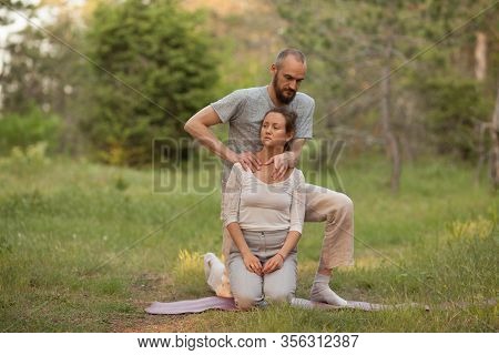 Yumeiho Massage Therapy. Masseur Young Man Doing Oriental Japanese Massage Yumeiho Girl. Concept Of 