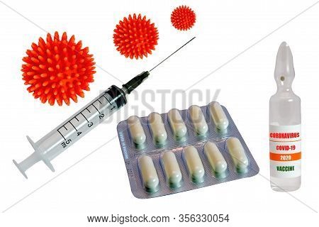 A Syringe And A Glass Ampoule With The Inscription Coronavirus Covid-19 Vaccine On The Background Of