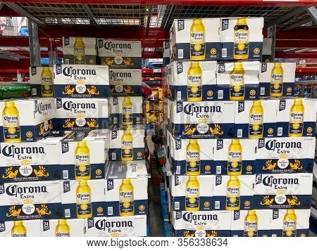 Orlando, Fl/usa-3/12/20: A Display Of Boxes Of Bottles Of Corona Extra On A Display Shelf Of A Sams 