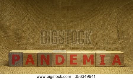 Wooden Cubes With Red Word Pandemia On Sackloth Background. Pandemia And Covid-19 Concept.