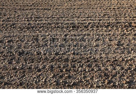 Plowed Field Background And Texture. Spring Agricultural Works Before The Cereal Planting Works. Ara