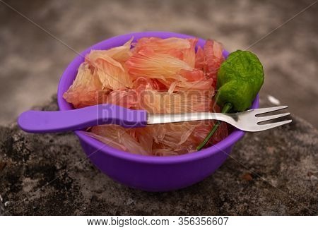 Pomelo (robab Tenga) Citrus Fruit Inner Parts With Ghost Chili Pepper (bhut Jolokia) And Fork Spoon 