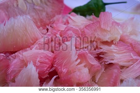 Pomelo (robab Tenga) Citrus Fruit Inner Parts With Ghost Chili Pepper (bhut Jolokia) Close View