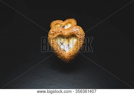 Heart Shaped Sponge Cake. Bakery Products. Black Background.