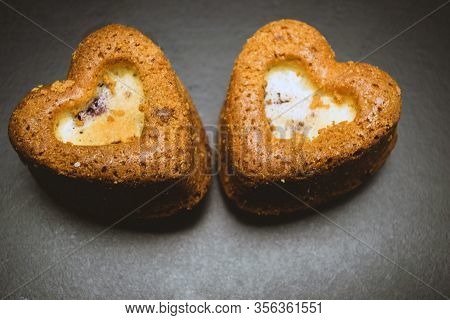 Heart Shaped Sponge Cake. Bakery Products. Black Background.