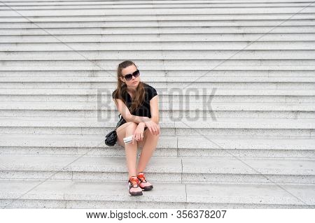 Traveling Alone. Solo Female Traveler. Tired Traveler Sit On Steps. Sexy Woman Rest On Stair. Leisur