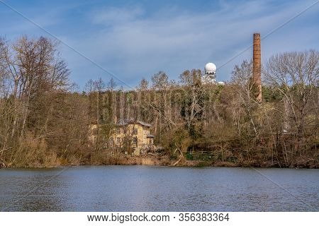 Teufelssee, Berlin, Germany - March 18, 2020: The Teufelssee Lake And Hill With The Oekowerk On A Su