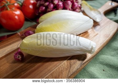 Fresh Belgian Endive Or Chicory Bitter Salad Ready To Cook Or Eat Close Up