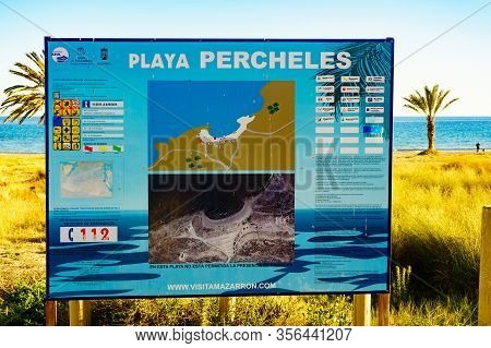 Percheles Beach, Spain - March 16, 2019: Percheles Beach Information Board, Mediterranean Coast In S